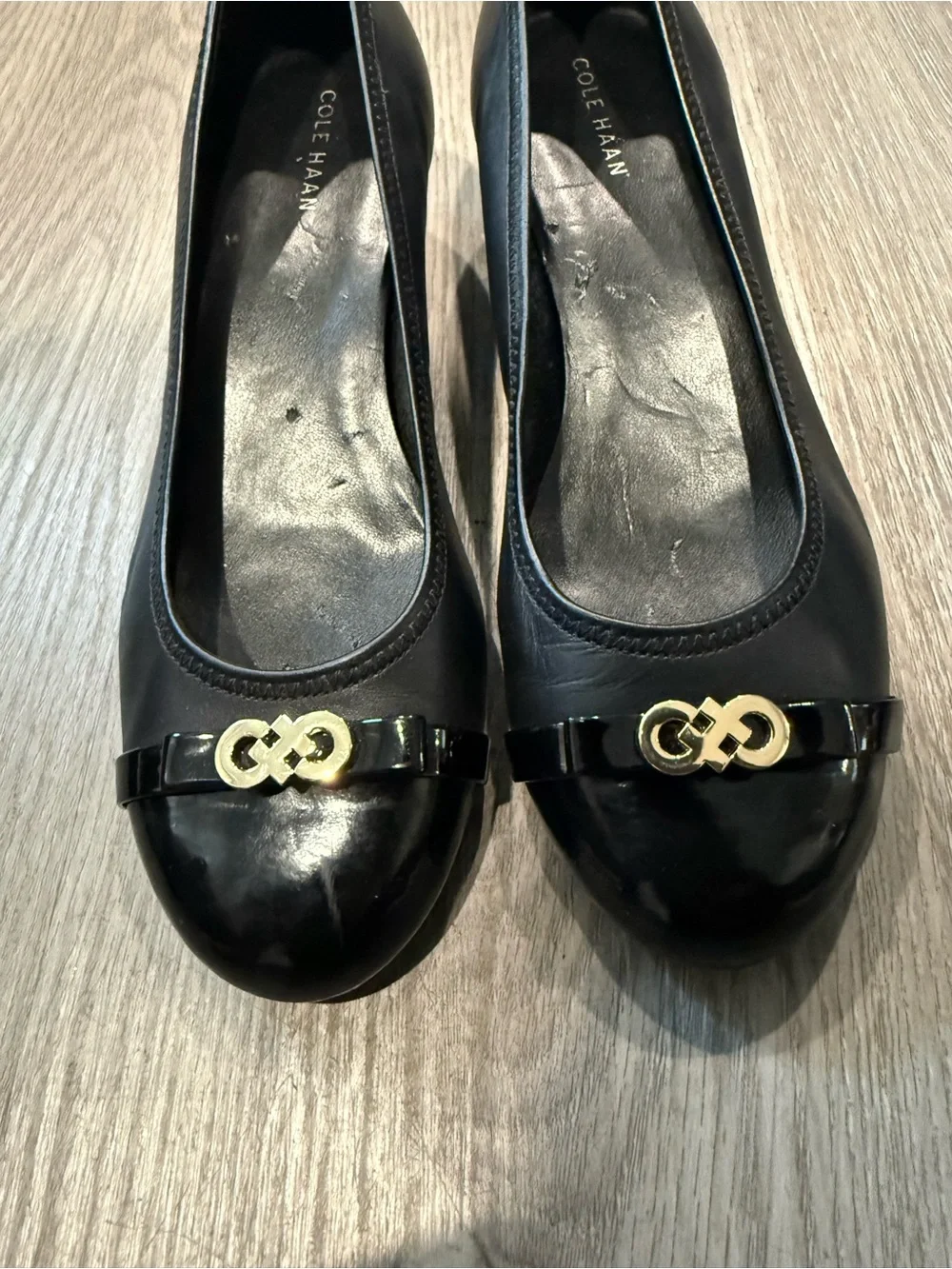 Cole Haan Black Leather Round-Toe Ballet Wedge Heels with Gold Logo Accent